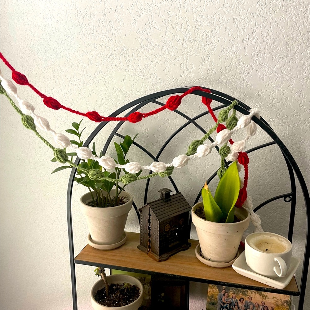 3 separate strands green, red and off white of homemade crocheted garland 9 ft